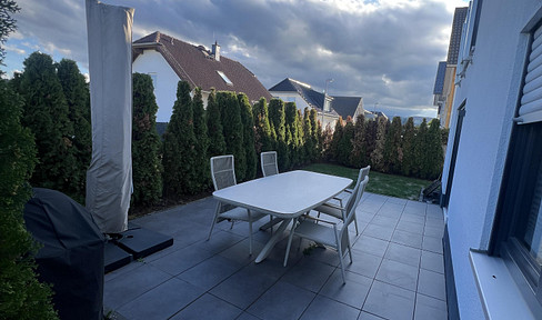 Exclusive apartment with a terrace and approximately 50 square meters of garden space.