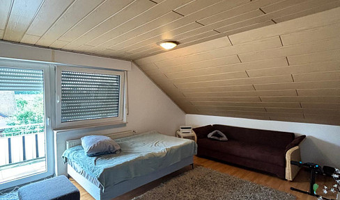 Cozy attic apartment with a balcony.