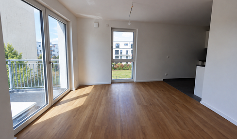 Modern 1-bedroom apartment with a terrace and a private garden area.