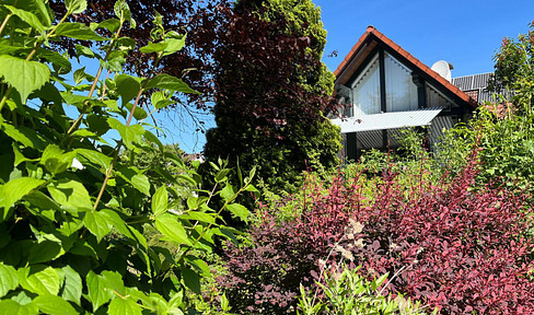 Attractive semi-detached house with a balcony, terrace, and well-maintained garden.