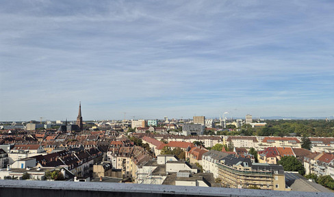 Apartment for sale: Renovated 3-room apartment with a west-facing terrace, fitted kitchen, and underground parking space, located with a beautiful view over the rooftops of Karlsruhe.