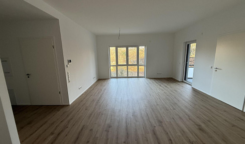 Modern, newly built 2-room apartment with a balcony and a view of greenery, located in a central area.