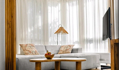 Temporary accommodation - bright, stylishly furnished apartment with a balcony and parking space in the western district of Gießen.