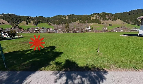 Land/Plot of land.
(Alternatively, depending on context: Building plot/Land for building.)