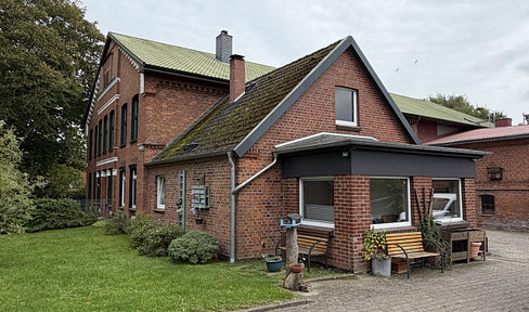 Smallholding with outbuildings and a building plot.