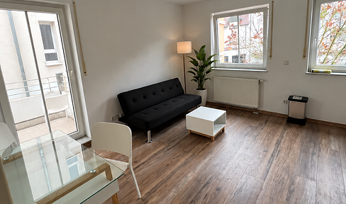 Stylish 2-room apartment with a balcony, located in a central city location, including a parking space in an underground garage.