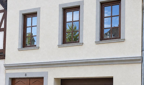 Well-maintained two-family house in Bingen-Stadt, featuring a courtyard and a garage.