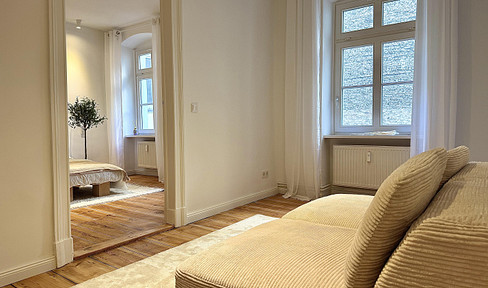 Renovated apartment in a historic building, available without any required references, located in the Mitte district of Berlin.