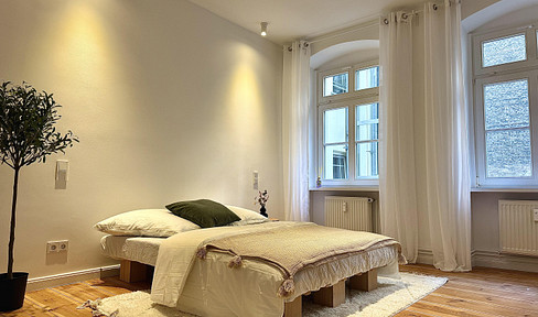 Renovated apartment in a historic building, available without any required references, located in the Mitte district of Berlin.