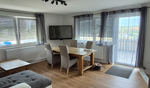 Spacious, renovated 4-room apartment with a new fitted kitchen, a sunny balcony, and stunning panoramic views.