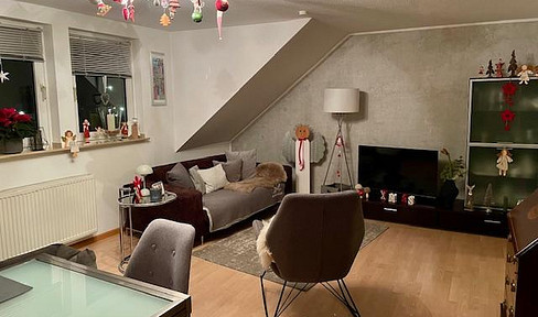 Bright attic apartment with a balcony and fitted kitchen.