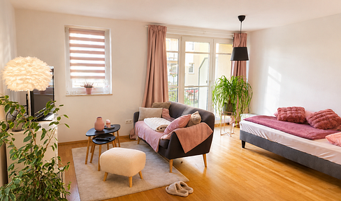 Bright, furnished apartment, a comfortable oasis with a balcony and a view of greenery.