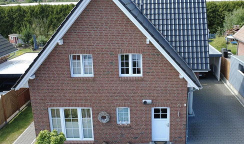 Modern single-family home built to KfW-55 standards, featuring a large garden, high-quality finishes, and plenty of privacy.
