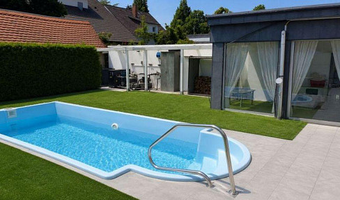 127 m² OF PRIVATE LIVING SPACE WITH A PRIVATE POOL & GARDEN – 2 GARAGES + €1,920 PER MONTH IN RENTAL INCOME.