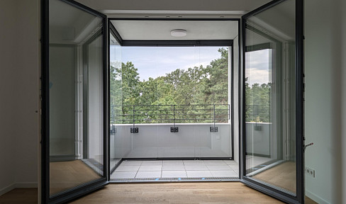 Brand new 2-room apartment for rent in Berlin-Westend, featuring a balcony and views of greenery.