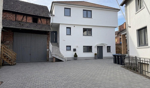 Dream home: Completely renovated house with a separate apartment, building permit, and barn.