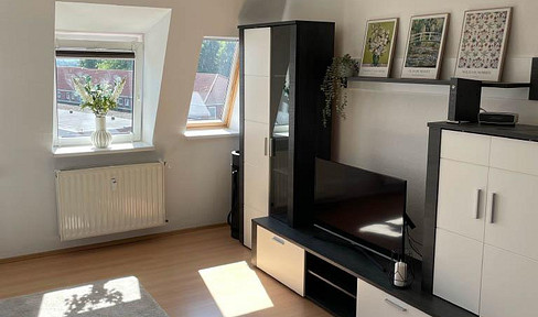 Beautiful 2-room apartment with fitted kitchen and parking space!