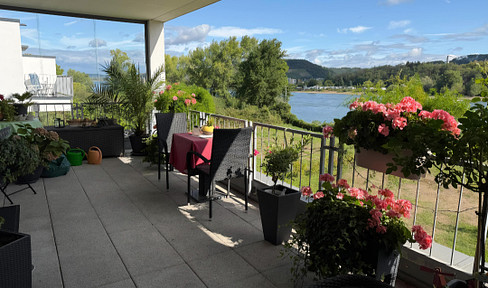 Exclusive 2-room apartment with a 22 m² balcony, located in a prime riverside location.