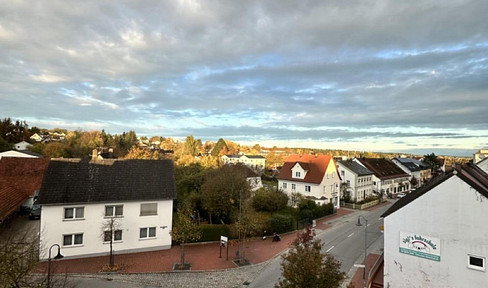 Bright, completely renovated 2-room apartment with a stunning view and top-quality features, located in the heart of Rottenburg.
