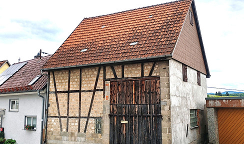 Unique property with potential: A substantial barn in a residential area, with a basement.
