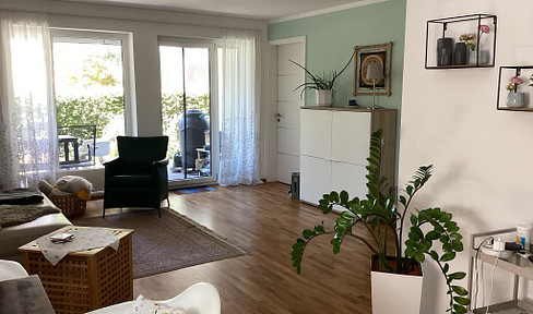 Sunny 2-room apartment with garden and garage.