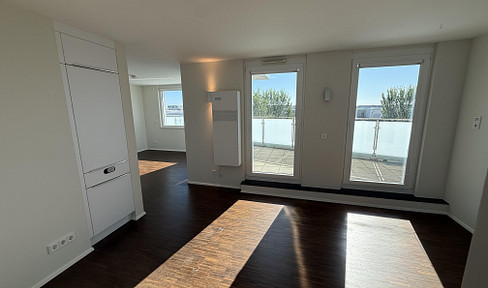 Penthouse apartment in Riedberg with a large rooftop terrace and skyline views – includes air conditioning, fitted kitchen, and 2 parking spaces in the underground garage.