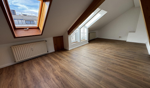 Renovated 2-room apartment in a city center location | new fitted kitchen, with views over the rooftops of Aachen.