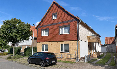 Two-family house with two garages and a large garden, located in Berka.