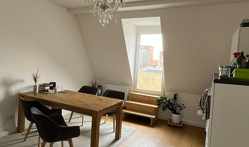 Stylish, completely renovated attic apartment in a historic building, featuring 3.5 rooms, a living kitchen, and a rooftop terrace.