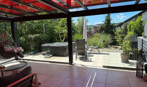 Beautiful smart home, completely renovated, with a sunroom, solar panels, a carport, and a garden.