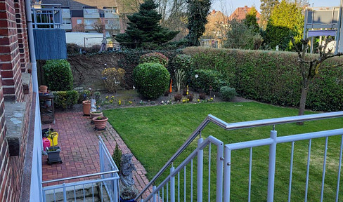Charming 4-room ground floor apartment with a large terrace, private garden, and double garage.