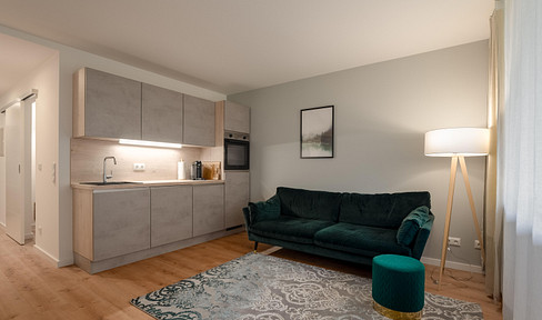 Beautiful 1.5-room apartment near the S-Bahn (suburban train) - with balcony, fitted kitchen, and modern design.