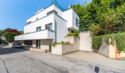 Exclusive villa with stunning views of the Alps and the lake, featuring luxurious amenities and spacious terraces.