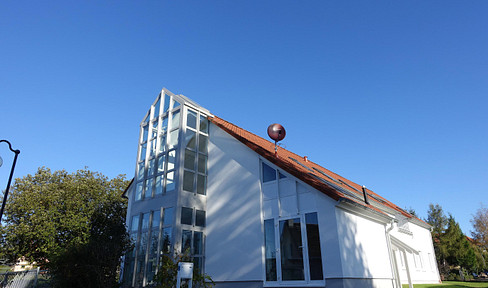 Bright and airy half of a house with a garden.