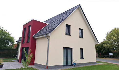 Modern, detached house with a double garage.