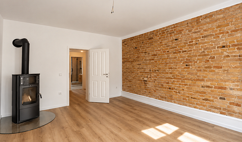Stylish, renovated 3-room apartment with a fireplace, exposed brick walls, and a high-quality bathroom.