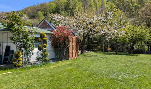 TAX-FREE: Multi-generational living in a detached house with a separate apartment and a south-facing garden.