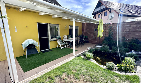 Beautiful 5-room apartment with a covered terrace, a garden with a koi pond, a garage, and a parking space – no homeowner's association fees.