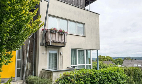 Bright 2-room apartment with a wide view, a balcony, and a parking space.