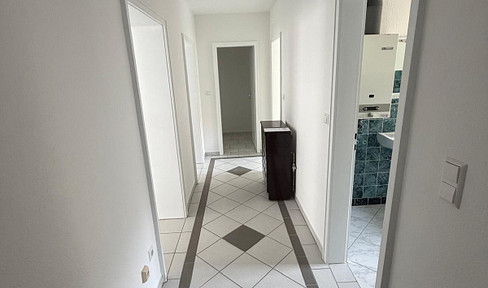 Renovated 2-room apartment with balcony and fitted kitchen.