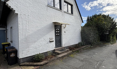 Charming single-family home with a loft space, a top-quality hobby basement, and a garage.