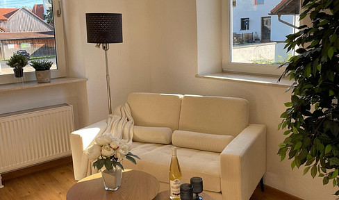 Completely renovated 1.5-room apartment with a new fitted kitchen, access to a garden, and a parking space.