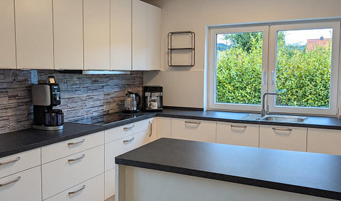 Beautiful semi-detached house for rent in Scheden – features include a fitted kitchen, garden, terrace, and garage.