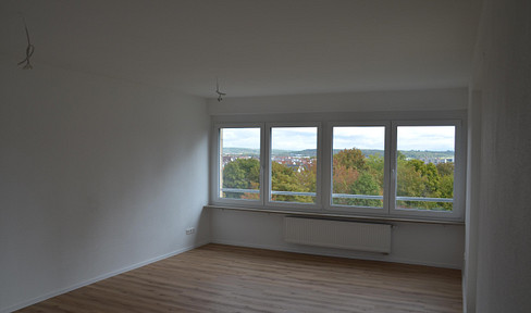 Modernized 3-room apartment with a glazed loggia, elevator access, and underground parking space.