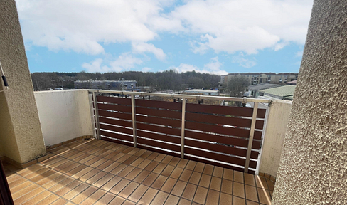 2-room apartment with a balcony and a parking space in a garage, located in Martinsried.