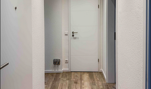 Renovated 3-room apartment with balcony - new windows, electrical system, heating, and fire safety features!