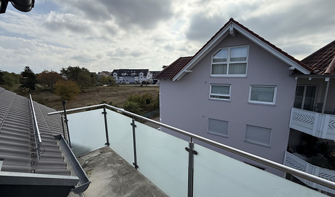 Newly renovated 2-room attic apartment with a south-facing balcony and views of the fields, located in Brühl-Rohrhof, and featuring district heating.