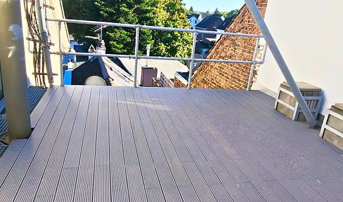 Apartment with 3 rooms, a large rooftop terrace, and an attic space, located above the rooftops of Merscheid.