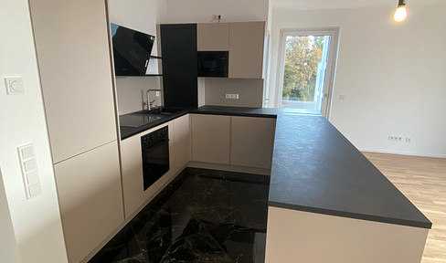 4-room apartment with a view of the cathedral, featuring 2 balconies and a fitted kitchen / New construction, first occupancy.