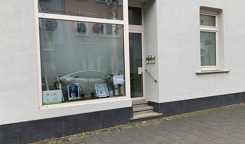 Charming retail space on the ground floor of a well-maintained historic building.